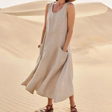 Beige linen dress with pockets designed for summer fashion, featuring a relaxed fit and suitable for eco-friendly style. The dress has sleeves and a defined waist, ideal for casual daytime wear. Shown in size 5XL, Bruno variant.