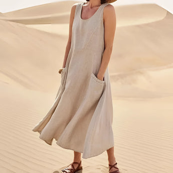 Beige linen dress with pockets designed for summer fashion, featuring a relaxed fit and suitable for eco-friendly style. The dress has sleeves and a defined waist, ideal for casual daytime wear. Shown in size 5XL, Bruno variant.