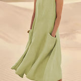 Beige linen dress with pockets, eco-friendly and suitable for summer fashion, displayed in a green color variant, size 5XL. The dress is a one-piece garment with short sleeves, designed for casual day wear, and features a comfortable waistline, ideal for warm weather.