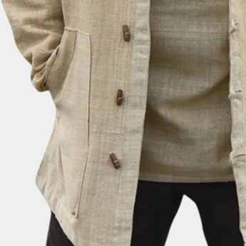 Beige linen mandarin collar shirt featuring long sleeves and a lightweight fabric, ideal for summer wear.