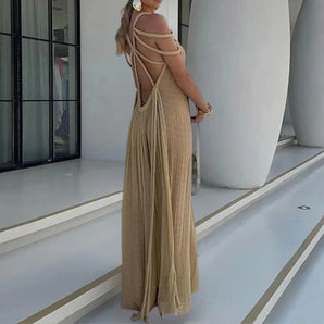 Beige maxi dress with strappy open back, suitable for summer beachwear, featuring a sleeveless design and a fitted waist.