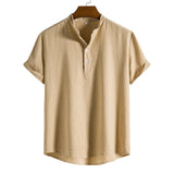 Beige men's short sleeve pleated shirt in a relaxed fit, featuring a collar and a khaki color.