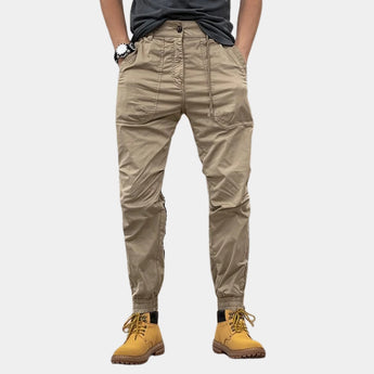 Men's beige slim fit cargo pants in khaki color, size 3XL, featuring a durable multi-pocket design suitable for outdoor wear.