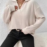 Women's beige oversized collar chunky knit sweater with long sleeves and a loose fit, perfect for casual winter wear.