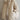 Beige oversized hooded puffer jacket in lightweight material, featuring long sleeves and a high collar, displayed in a khaki color, size large.
