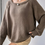 Beige oversized off-shoulder knit sweater featuring a trendy fall fashion design, showcasing long sleeves and a comfortable neckline.
