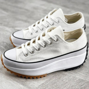 Beige platform sneakers with chunky sole and star heel detail for women's streetwear.