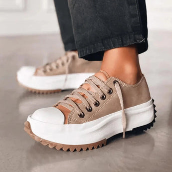 Beige platform sneakers with chunky sole and star heel detail, displayed in oak brown color, size 43.