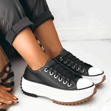 A pair of beige platform sneakers with chunky soles and star heel details, styled for women's streetwear, shown in Corvinus Black, size 43.