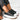 A pair of beige platform sneakers with chunky soles and star heel details, styled for women's streetwear, shown in Corvinus Black, size 43.