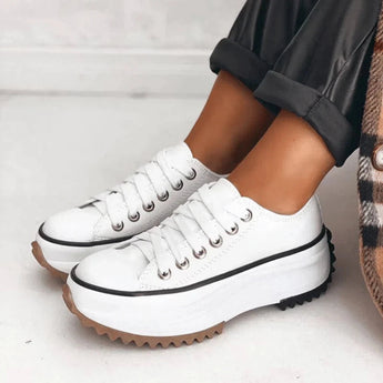 Beige platform sneakers with chunky sole and star heel detail for women's streetwear, shown in Alpine White, size 43.