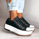 Beige platform sneakers with chunky sole and star heel detail, designed for women's streetwear fashion.