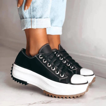 Beige platform sneakers with chunky sole and star heel detail, designed for women's streetwear fashion.