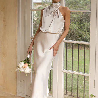 Beige sleeveless backless midi dress in champagne color, featuring elegant design elements suitable for wedding and cocktail events, shown in size 3XL.