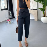 Beige sleeveless belted jumpsuit displayed on a hanger against a neutral backdrop, highlighting its casual chic style perfect for summer outings.