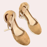 Beige suede espadrilles featuring a closed toe design, wedge heel, and an adjustable ankle strap, shown in a brown color variant and size 40.