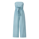 Elegant light blue sleeveless jumpsuit with a tie waist, suitable for summer wear; features a collar resembling a blazer style, adding a formal touch to the casual design.