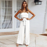 Beige sleeveless jumpsuit with tie-waist, designed for elegant and casual summer wear.