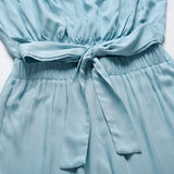 Beige sleeveless tie-waist jumpsuit, elegant design suitable for casual summer wear.