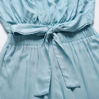Beige sleeveless tie-waist jumpsuit, elegant design suitable for casual summer wear.