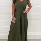 
A dark green V-neck wide-leg jumpsuit designed for elegant formal summer occasions, featuring short sleeves, a cinched waist, and a flowing one-piece style suitable for size 2XL, displayed on a mannequin or hanger.