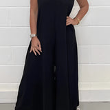 Elegant beige V-neck wide-leg jumpsuit with short sleeves, designed for formal summer occasions, shown in size 2XL.