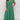Green V-neck wide-leg jumpsuit in size 2XL, featuring elegant shoulder detailing and a tailored waist, ideal for formal summer occasions.