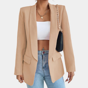 Beige women's blazer with an open front design, featuring long sleeves and a classic collar, styled for a casual chic look.