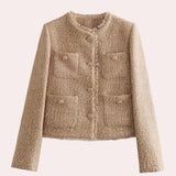 Beige women's bouclé double-breasted blazer on a clothes hanger, featuring long sleeves, a collar, and a chic design perfect for fall outerwear in a khaki color, size XL.