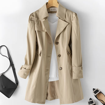 Beige women's double-breasted short trench coat with a fitted waist, featuring a classic collar and long sleeves, shown in size 5XL in a cachi color.