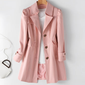 Pink women's double-breasted short trench coat featuring a fitted waist, buttoned closure, long sleeves, and a classic collar design.