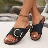 Beige women's flat buckle sandals with a comfortable cork sole, shown in black, size 41, highlighting foot and toe details in a close-up view.