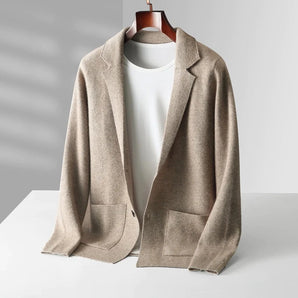 Beige women's lightweight casual linen blazer with a collarless open front design, featuring long sleeves and a tailored fit suitable for fashion-conscious individuals seeking stylish outerwear.