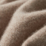 Beige women's lightweight casual linen blazer with a collarless open front design, displayed on a wooden surface.