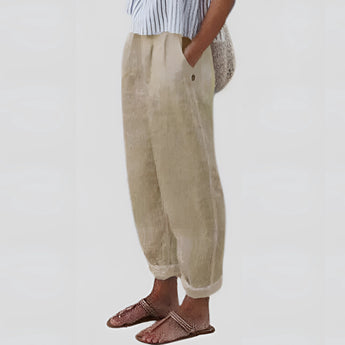 Beige women's linen pants in size 3XL, featuring an elastic waist. The pants are lightweight and sustainable, shown in a casual yet stylish fashion setting.