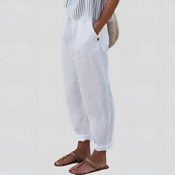 Women's white linen pants in size 3XL, featuring an elastic waist, lightweight and sustainable material, shown in a formal wear setting.