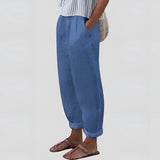 Beige women's linen pants featuring an elastic waist, designed for lightweight comfort and sustainability.