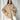 Beige women's oversized fleece bomber jacket with long sleeves, showcasing trendy winter fashion.