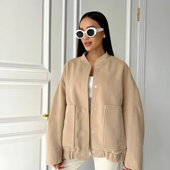 Beige oversized fleece bomber jacket for women styled in trendy winter fashion, featuring a khaki color in XL size with a stylish collar and long sleeves.