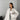 Beige oversized fleece bomber jacket for women with a trendy winter fashion design, featuring a collar and long sleeves, styled in the White XL variant. The model with black hair is showcasing the jacket, highlighting its casual yet fashionable appeal.
