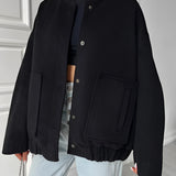Beige women's oversized fleece bomber jacket, showcasing trendy winter fashion with a warm and cozy design, featuring long sleeves and a comfortable fit.