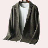 Olive green oversized wool blazer for women, featuring a notch lapel, long sleeves, and a classic collar, styled for autumn wear.