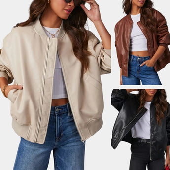 Beige women's satin bomber jacket, lightweight and casual chic, worn by a woman paired with black jeans.