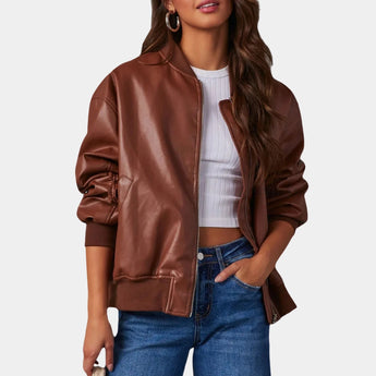 A beige women's satin bomber jacket in a lightweight design, styled with an emphasis on casual chic. The jacket features a zipper closure, ribbed collar, cuffs, and hem, and is paired with jeans. The model is wearing a size XL in a brown variant, showcasing the jacket's fit on the shoulders, arms, and waist.
