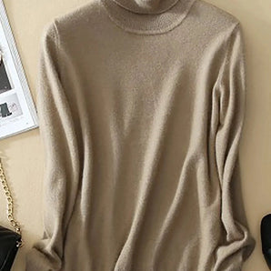 Beige women's turtleneck sweater with ribbed trim, displayed on a clothes hanger, featuring long sleeves and a soft knit fabric, shown in a khaki color, size 3XL.