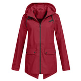 A stylish burgundy women's raincoat in size 2XL, featuring a hood and waterproof material. The lightweight coat has a button closure, long sleeves, and a tailored design with a collar, combining practicality with fashion.