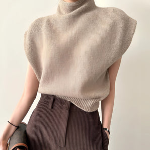 Light brown sleeveless turtleneck sweater in a wool blend, featuring a cozy and stylish design for women's winter fashion.