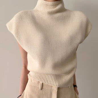Sleeveless beige wool blend turtleneck sweater for women, showcasing winter fashion with a cozy design and elegant silhouette, featuring a high neck and soft texture.