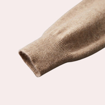 Beige wool cowl neck sweater for women with long sleeves, displaying elegant winter knitwear style.