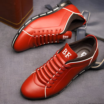 Men's red leather dress shoes, stylish pointed loafers with a sleek design.